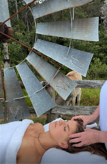 Head Massage outdoor in front of a windmill