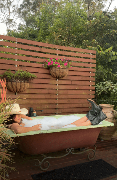 Lady relaxing in the outdoor Bath