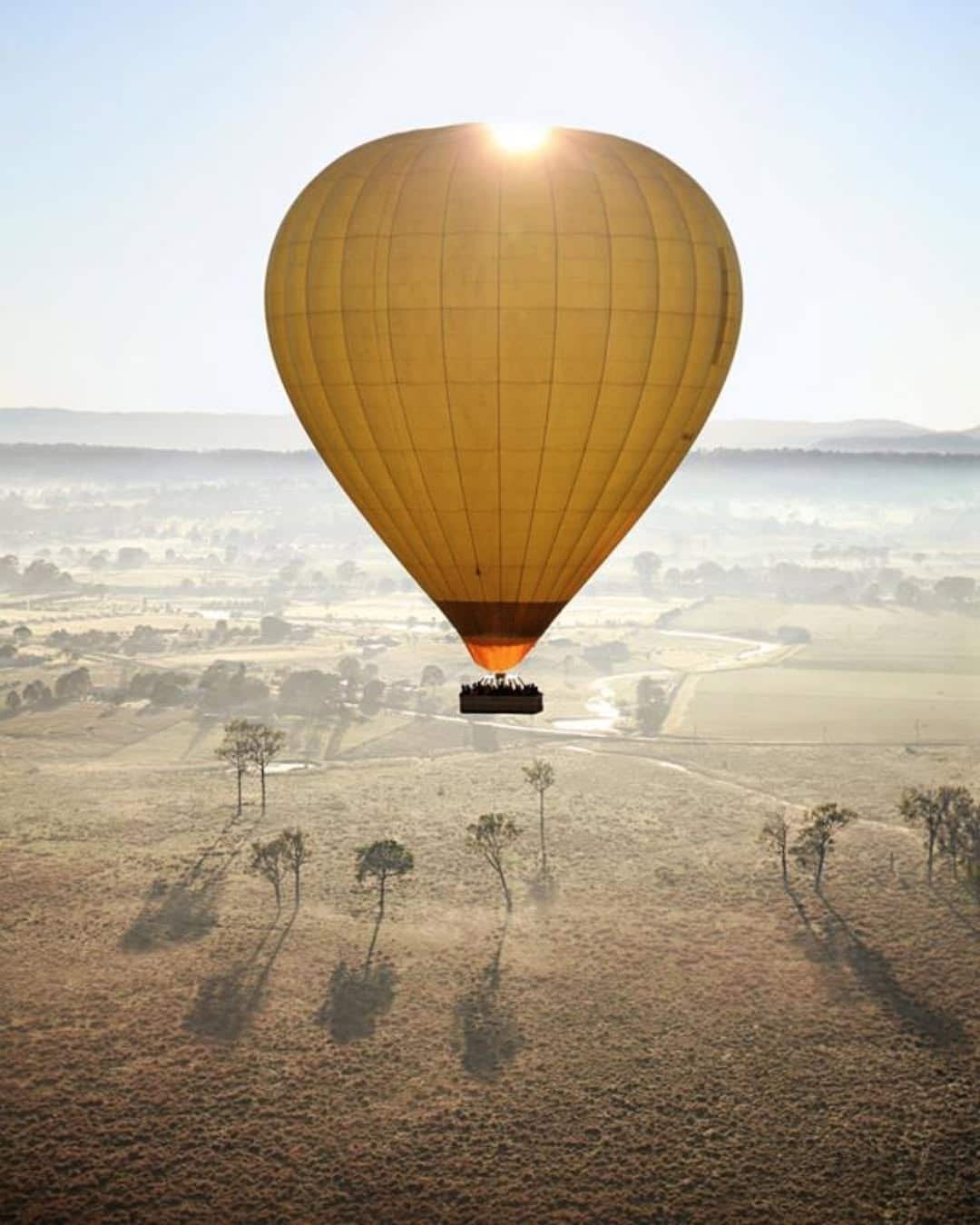 Hot air Ballon gliding through the air over the Atherton Tablelands